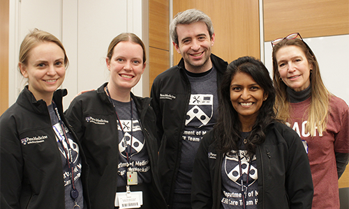 The teammates of Pennicillin Hackers and Debra Laumer standing together