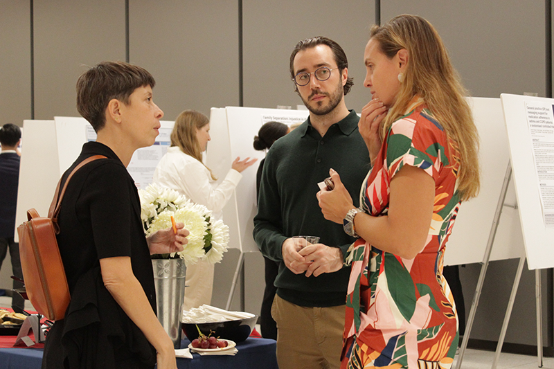 Three attendees in discussion