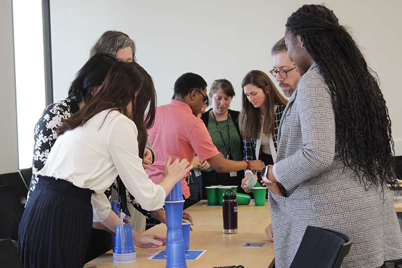 Teams experiment with cup-stacking methods